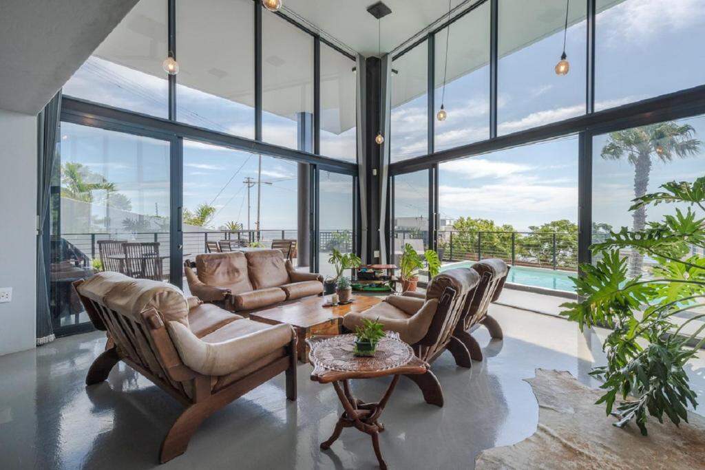 Shared lounge with ocean and pool view at Villa on Ocean View, Sea Point