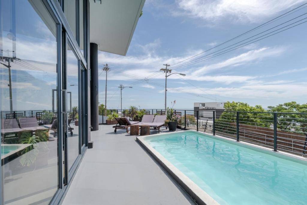 Heated outdoor swimming pool and sun deck at Villa on Ocean View